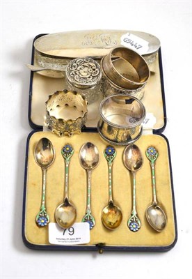 Lot 79 - A set of six Arts & Crafts silver and enamel coffee spoons, Birmingham 1914, with flowerhead...