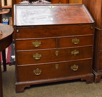 Lot 1343 - An Oak Bureau, 18th century, with stepped...