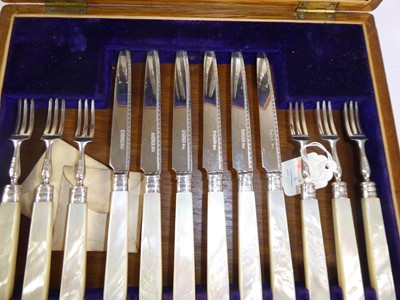 Lot 2054 - A Cased Set of Twelve Pairs of George V Silver and Mother-of-Pearl Fruit-Eaters
