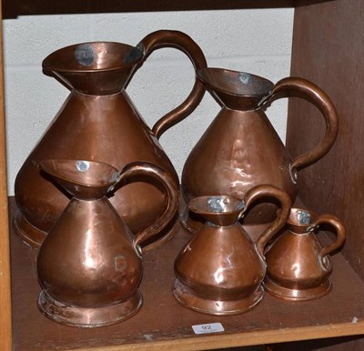 Lot 92 - Graduated set of five copper spirit measures