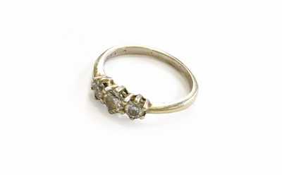 Lot 189 - A Diamond Three Stone Ring, the graduated...