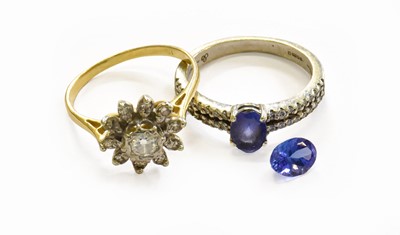 Lot 180 - A Diamond Cluster Ring, stamped '18', finger...