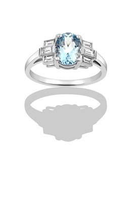 Lot 2340 - An Aquamarine and Diamond Ring the oval cut...