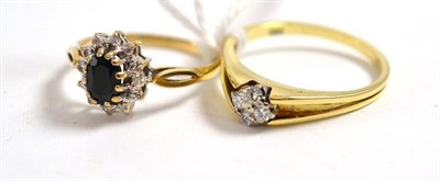 Lot 115 - A diamond cluster ring, stamped '585' and a sapphire and diamond cluster ring