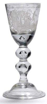 Lot 12 - A Lauenstein Goblet, circa 1730, the rounded funnel bowl engraved with a humorous scene depicting a