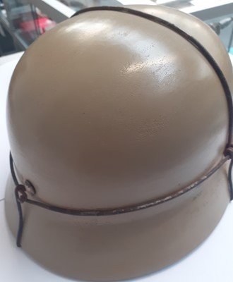 Lot 125 - A Second World War German M35 Helmet, finished...