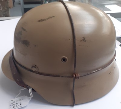 Lot 125 - A Second World War German M35 Helmet, finished...