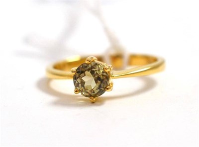 Lot 124 - An 18ct gold solitaire ring - possibly diopside or diaspore