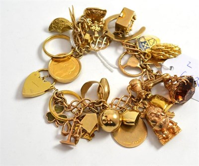 Lot 127 - A 9ct gold charm bracelet