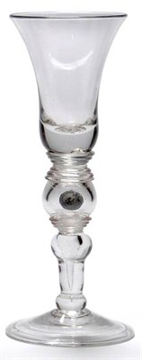 Lot 15 - A Baluster Coin Goblet, circa 1730, the bell shaped bowl on an annular collar, the hollow knop...