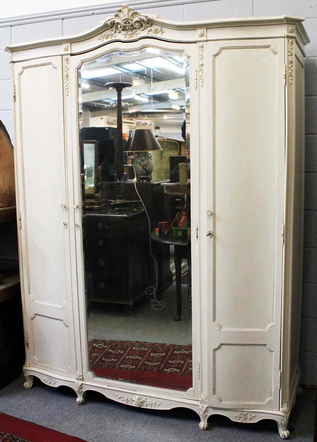 Lot 1348 - A Painted Mirrored Triple Wardrobe, 175cm by...