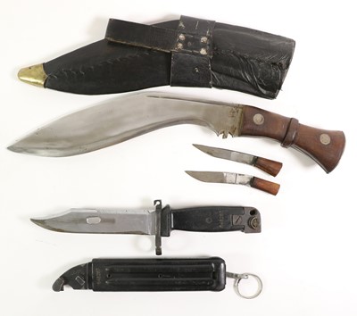Lot 184 - A Nepalese Kukri, the 29cm steel blade with a...