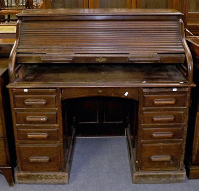 Lot 1313 - An Early 20th Century Oak Roll Top Desk, with...