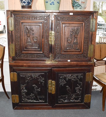Lot 161 - A Chinese Padouk Wood and Brass Bound Cabinet,...