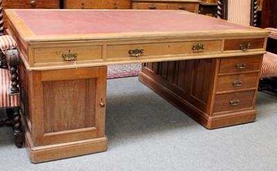 Lot 1242 - An Oak Partners Desk, circa 1900, with a red...