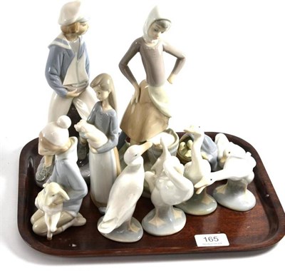 Lot 165 - Nine Lladro figures