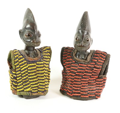 Lot 225 - A Pair of Yoruba Ibije, Nigeria, carved from...