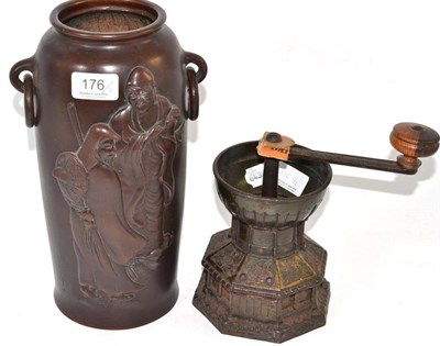 Lot 176 - A Japanese bronze vase cast with scribes and a 'font' coffee mill