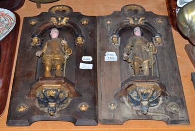 Lot 180 - A pair of Continental carved wood plaques as gallants in archways