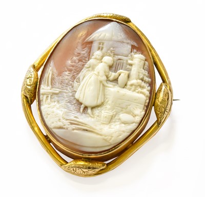 Lot 175 - A Cameo Brooch, in a scroll frame, measures...