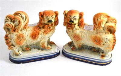 Lot 187 - A pair of Staffordshire pottery figures of Pekinese dogs