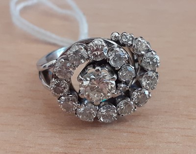 Lot 2013 - A Diamond Cluster Ring the central round...