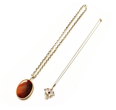 Lot 169 - An Agate Pendant on Chain, the oval agate in a...