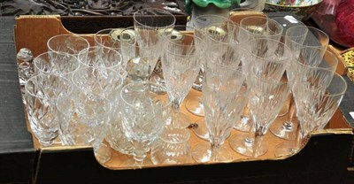 Lot 196 - A set of ten Stuart cut glass champagne flutes and six wine glasses, a set of four cut glass...