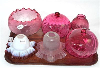 Lot 197 - Three cranberry glass lamp shades, an opaque and ruby glass frilled lamp shade and a pair of...