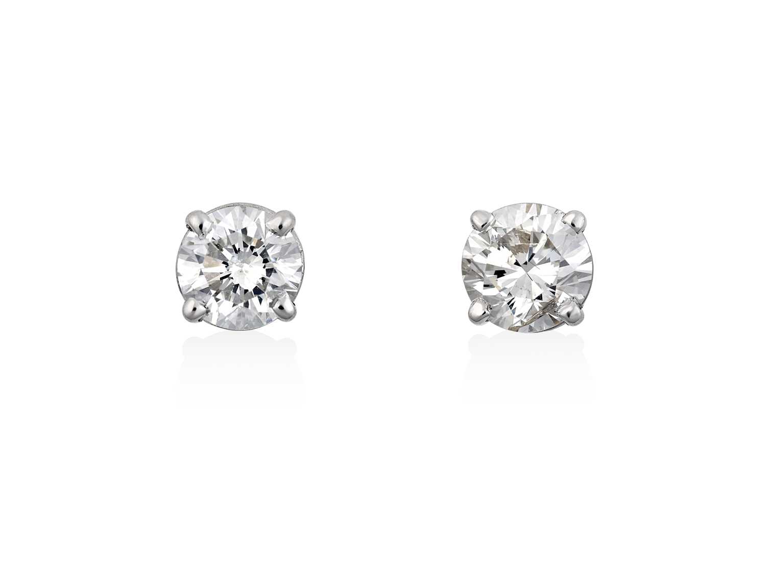 Lot 2089 - A Pair of Diamond Solitaire Earrings the old...