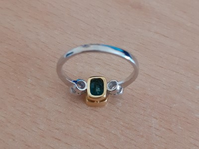 Lot 2035 - An Emerald and Diamond Three Stone Ring the...
