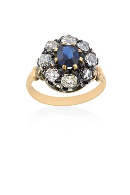 Lot 2138 - A Synthetic Sapphire and Diamond Cluster Ring...