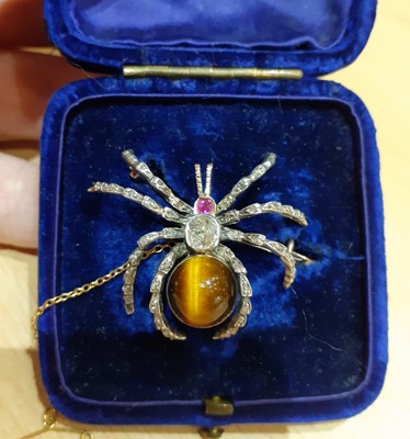 Lot 2189 - A Diamond, Synthetic Ruby and Tiger's-Eye...