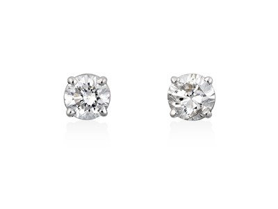 Lot 2089 - A Pair of Diamond Solitaire Earrings the round...