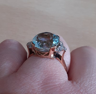 Lot 2046 - An Aquamarine and Diamond Ring the round cut...
