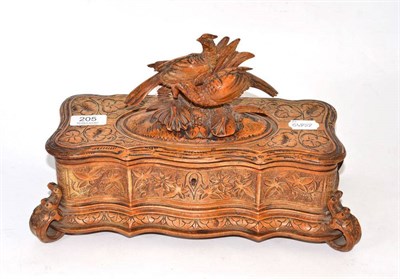 Lot 205 - A Black Forest bird carved wood casket