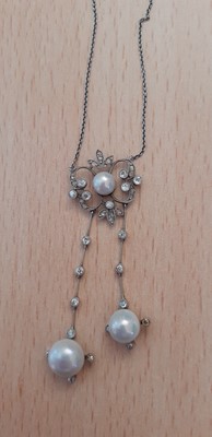 Lot 2001 - A Pearl and Diamond Necklace the central pearl...