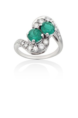 Lot 2036 - An Emerald and Diamond Twist Ring the round...