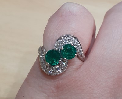 Lot 2036 - An Emerald and Diamond Twist Ring the round...