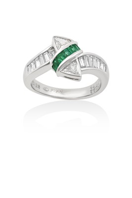 Lot 2033 - An Emerald and Diamond Ring a row of calibré...