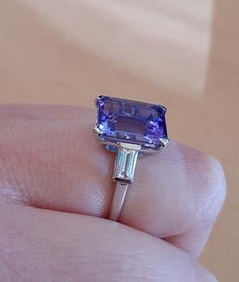 Lot 2096 - A Tanzanite and Diamond Ring the emerald-cut...