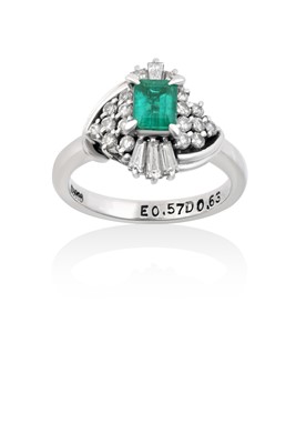Lot 2064 - An Emerald and Diamond Cluster Ring the...