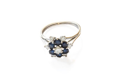 Lot 124 - A Sapphire and Diamond Cluster Ring, unmarked,...