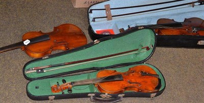 Lot 211 - A violin and two bows, cased; a violin for a child, cased and another uncased example (3)