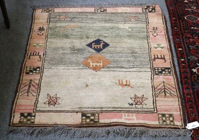 Lot 1281 - A Gabbeh Rug, the abrashed field of zoomorphic...