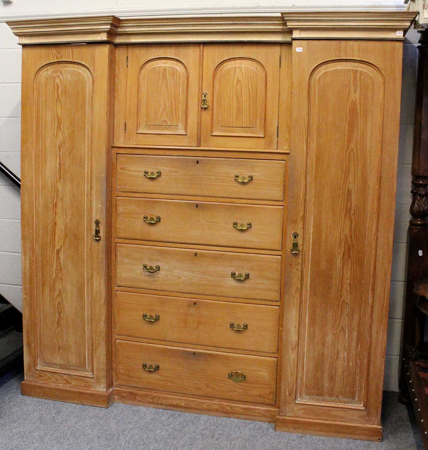 Lot 1275 A Large Pine Corner Wardrobe and A Pine