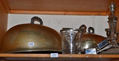 Lot 234 - A shelf of silver plated ware including two meat dish covers, a candelabrum, a pair of...