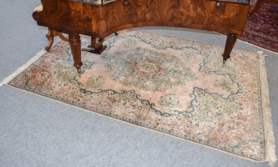 Lot 1112 - A Kashmir Silk Rug, the salmon pink ground...