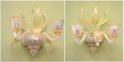 Lot 239 - A pair of two branch Venetian glass wall lights, the opalescent branches with fleckled gilt...