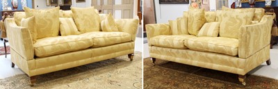 Lot 781 - A Pair of Feather-Filled Three-Seater Sofas,...